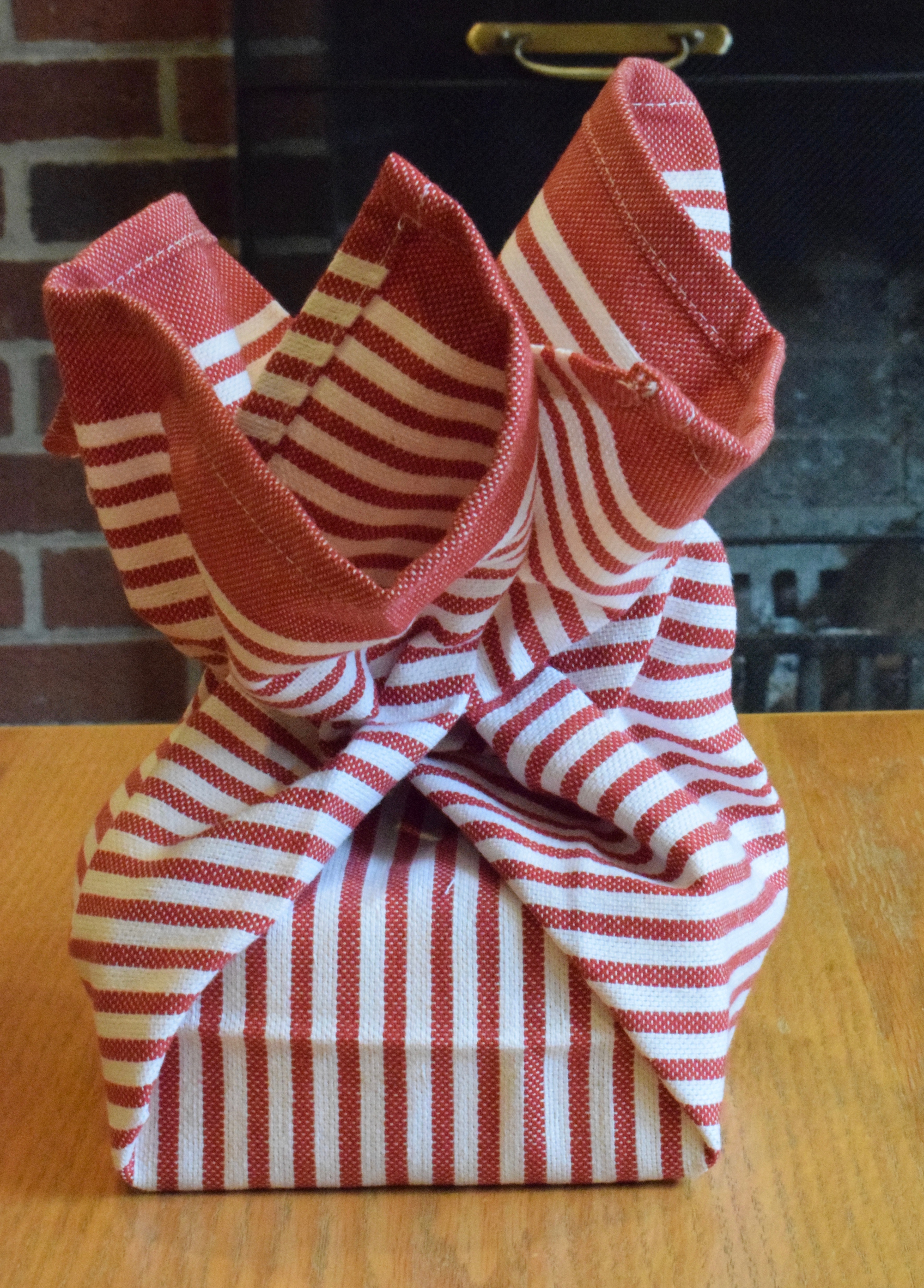How to Wrap Gifts in Kitchen Towels Step Two Sides Pulled Up, Reusable Gift Wrapping