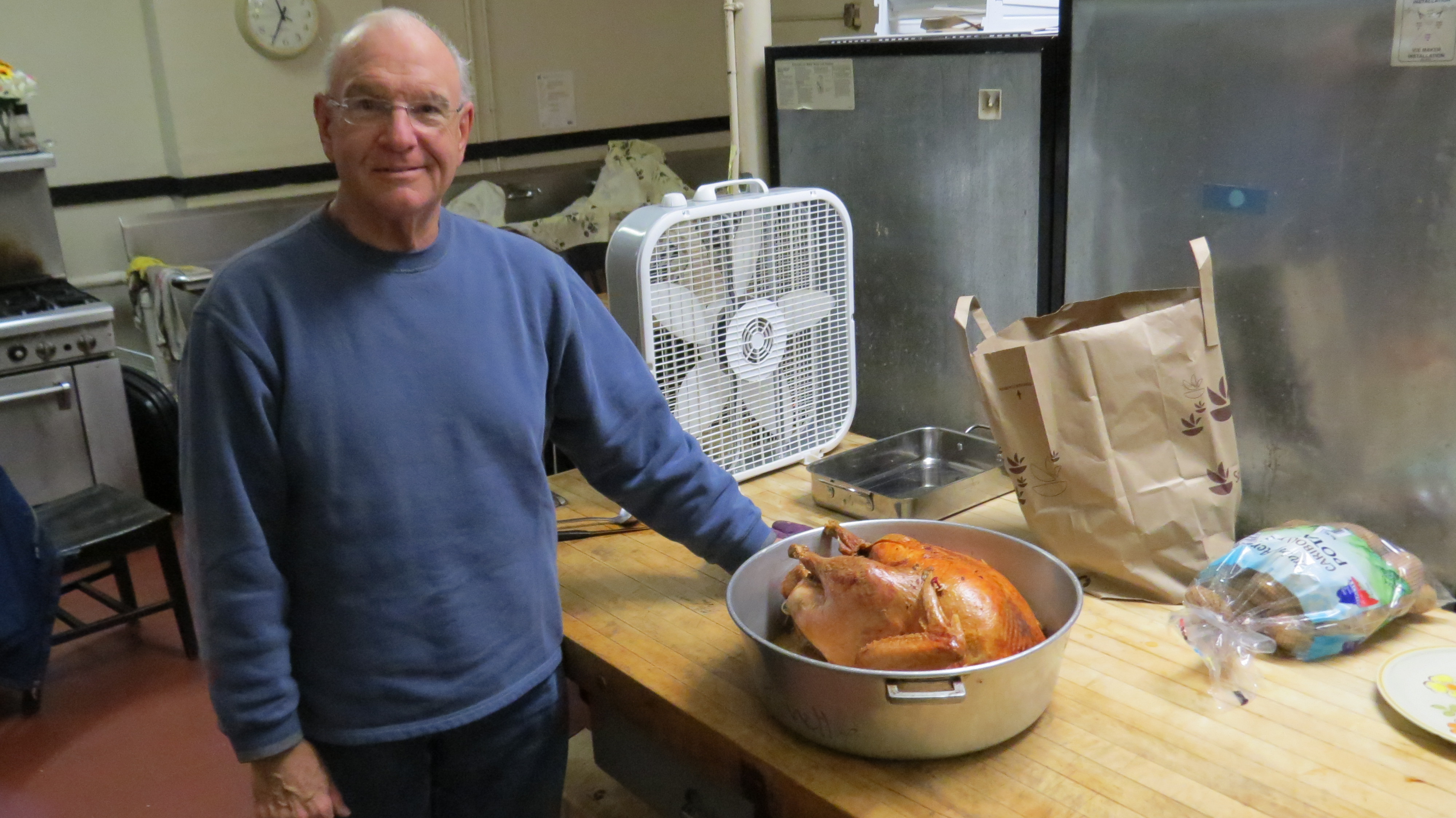 Chuck Bennett with the turkey he cooked for Thanksgiving