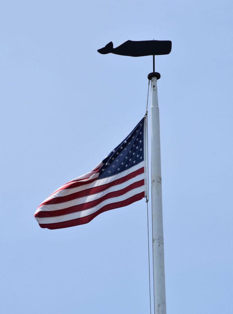 It's the weekend! Number 209, American Flag on a Flagpole Topped with a Whale Sculpture in Edgartown, MA