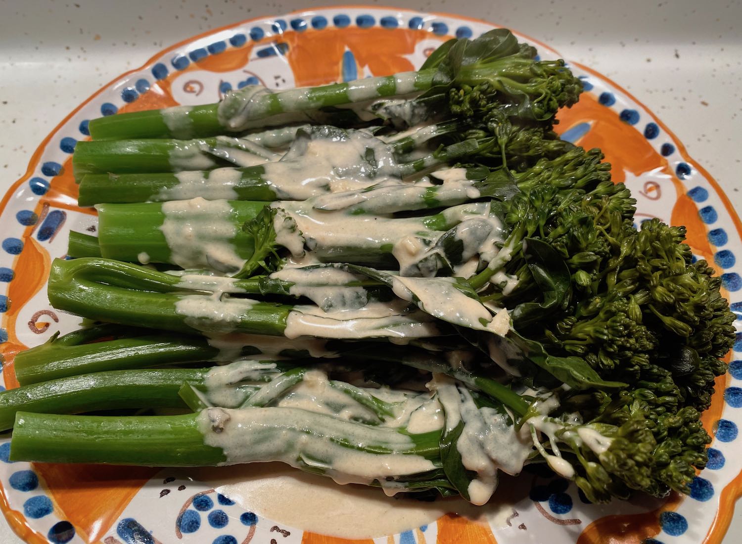 Lemon Tahini Dressing Drizzled Over Broccolini