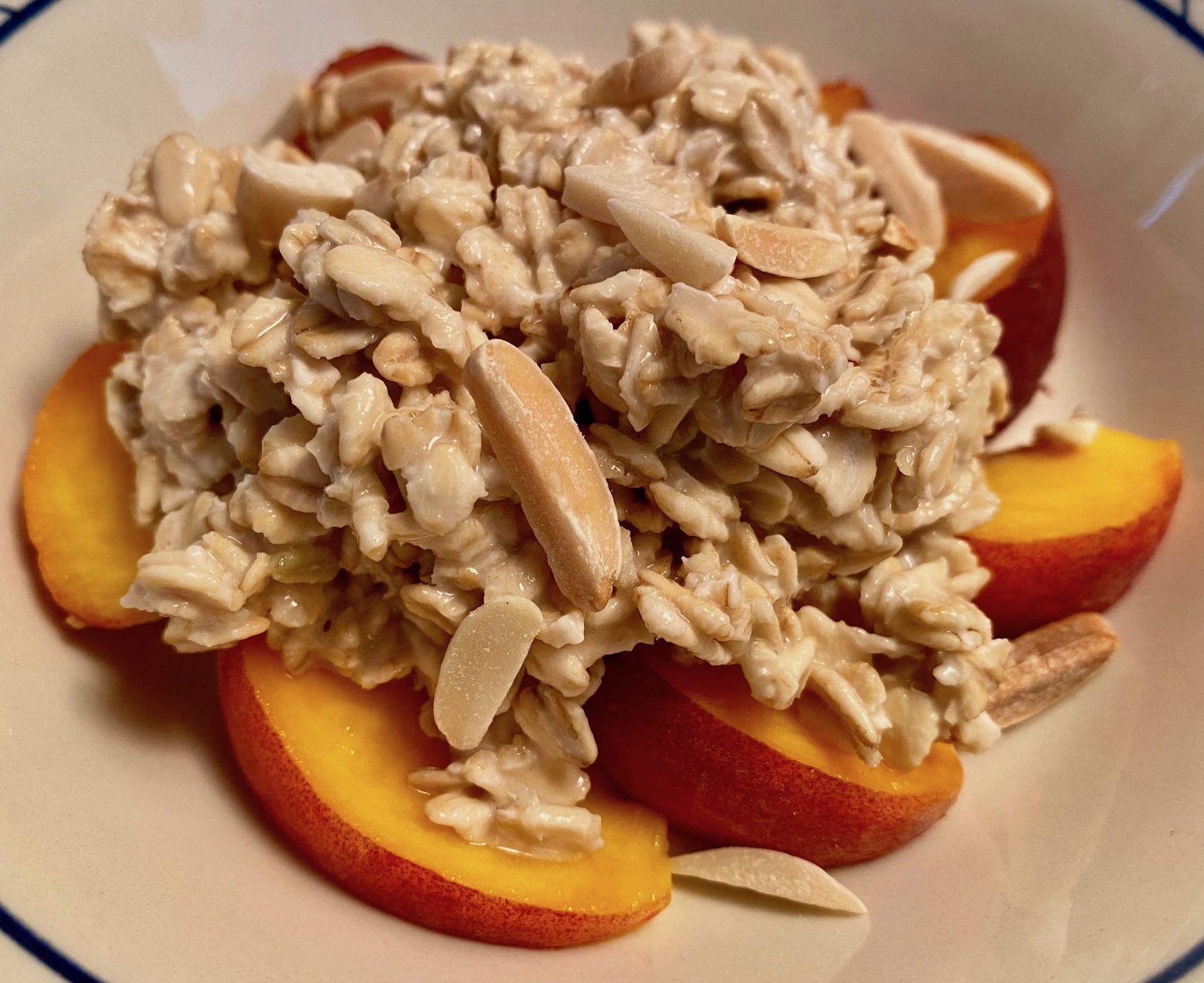 Almond Overnight Oats with Sliced Peaches and Toasted Almond Slivers