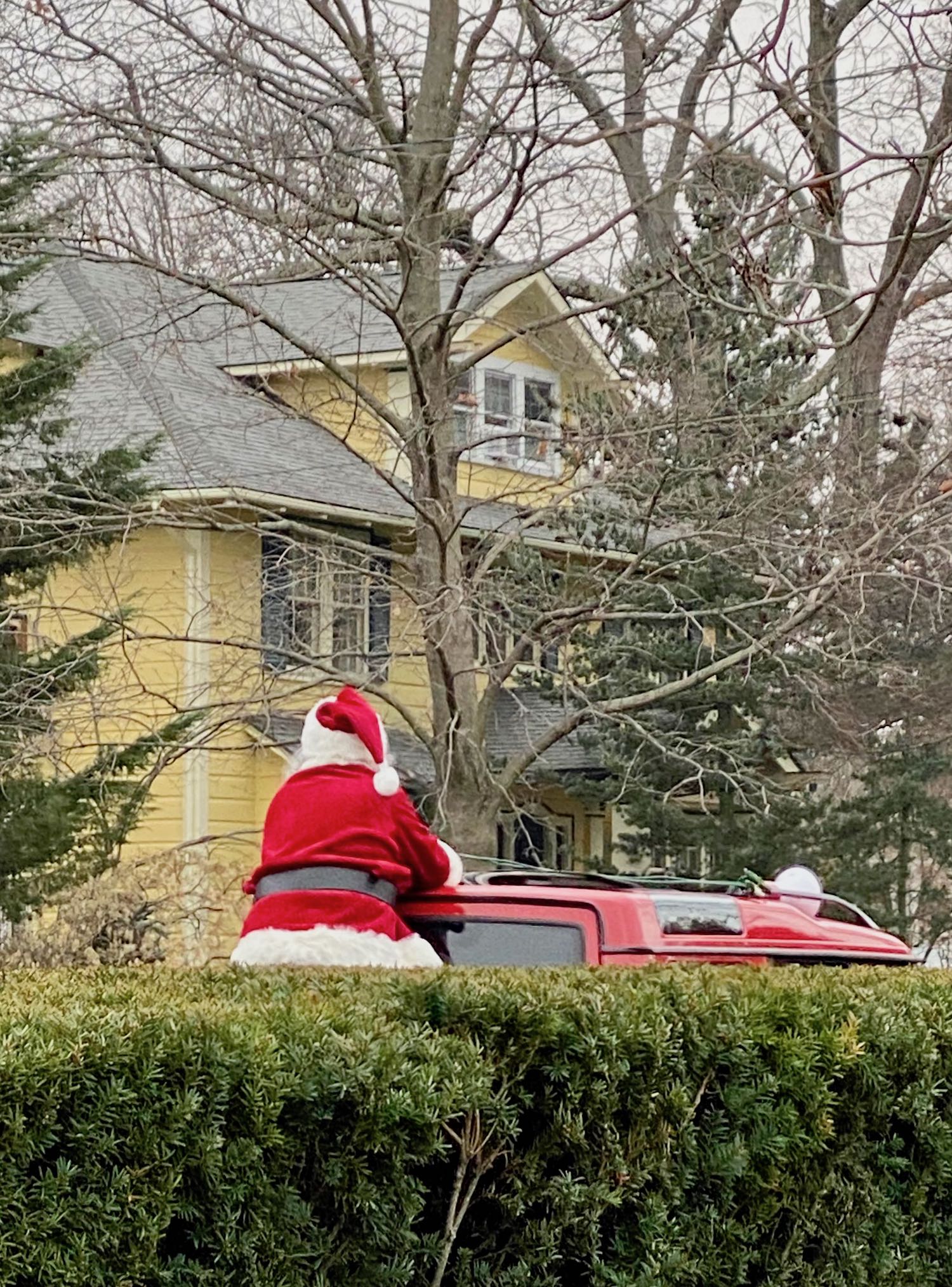 It's the weekend! Number 276, Santa Rides a Red SUV Through a Local Neighborhood