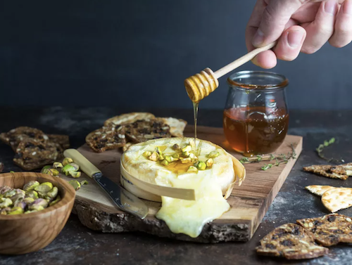 Baked Brie with Honey and Pistachios from Serious Eats
