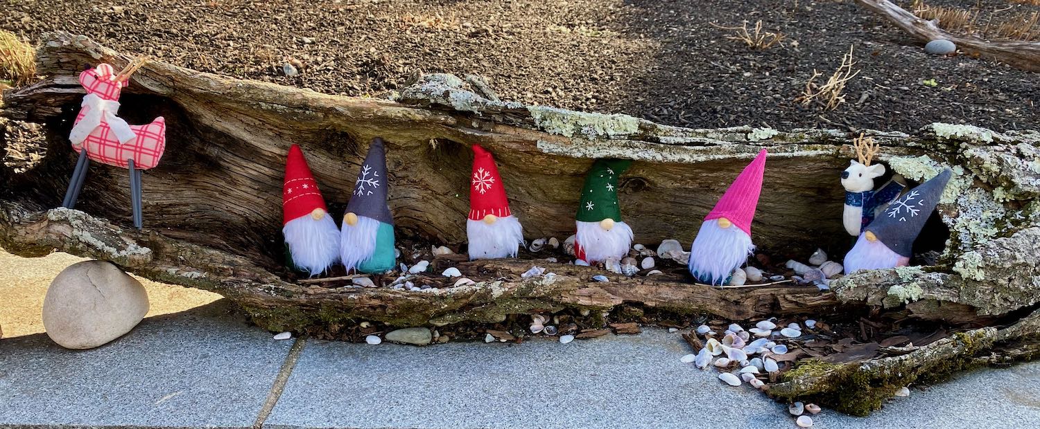 Neighborhood Holiday Display Gnomes in a Hollow Log