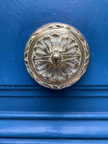 Ornate Parisian Door Knocker on Blue Door