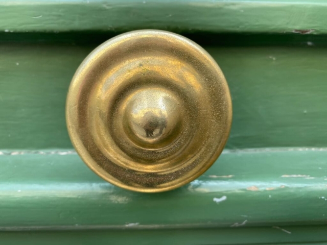 Round Parisian Door Knob on a Green Door